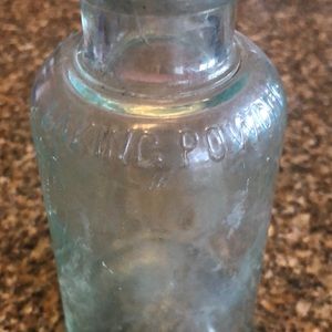 Antique glass baking powder bottle